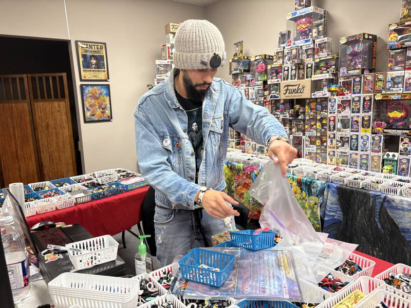 Andrew Rios bags items at Andy's World in Woodstock Sunday, Feb. 2, 2025.