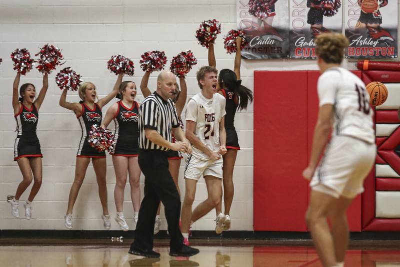 Yorkville's Nathan Kubin (24) yells out after his game ending dunk during their basketball game between Oswego at Yorkville Friday, Dec 12, 2025 in Yorkville.