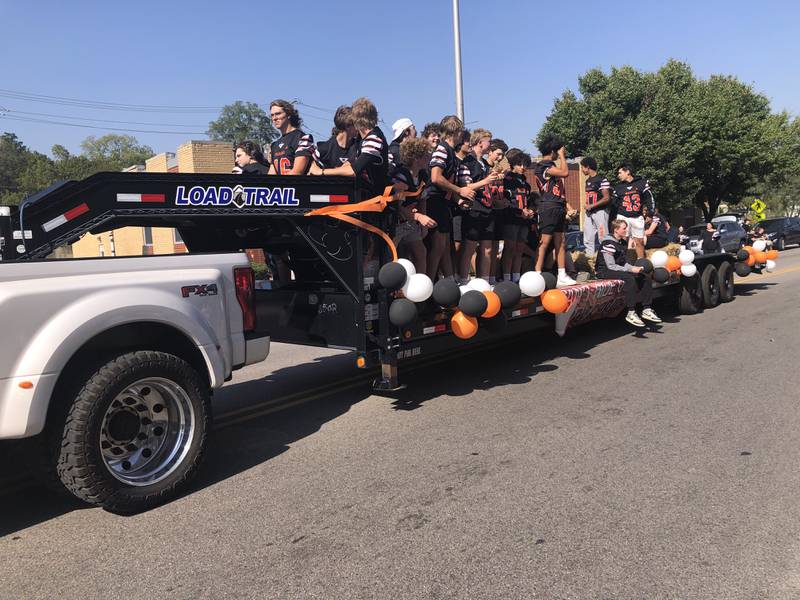 The McHenry High School football team participates in the Homecoming parade Oct. 6, 2024.