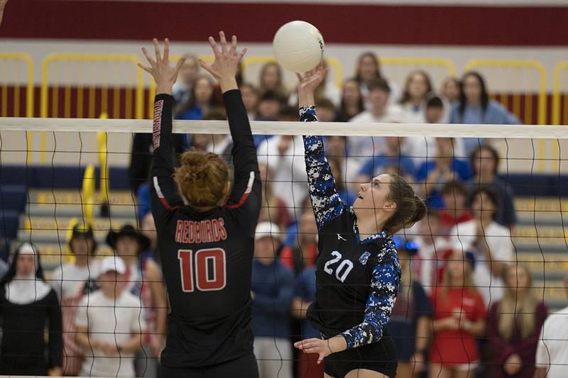 St. Francis’ CeCe Gilroy spikes the ball Friday, Nov. 4, 2022 during the Spartan’s 3A supersectional game against Metamora.