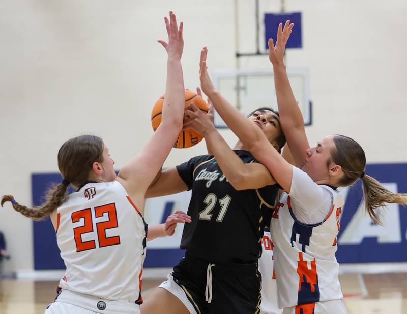 Bishop McNamara’s Keneyce Davis attempts a layup under pressure during the Fightin’ Irish’s 46-32 loss to Pontiac in the IHSA Class 2A Pontiac Sectional semifinal on Tuesday, Feb. 24, 2026, at Pontiac Township High School.