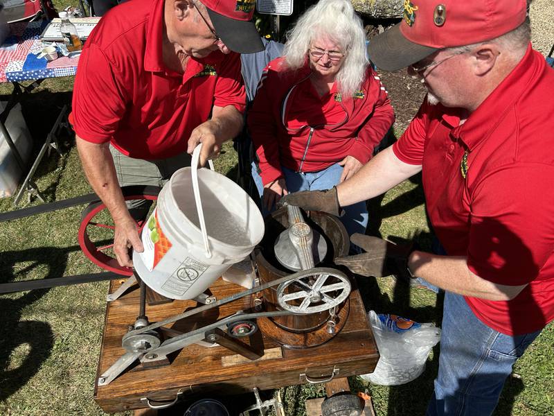 Larry, Sandra, and Ralph Flickinger of Sugar Grove were making fresh ice cream with antique equipment at Hough's Maple Lane Farm during the Back Roads Market event on Saturday, Sept. 28, 2024 north of Mt. Morris. The Flickingers made ice cream on site with their vintage hit-n-miss stationary engine. They also had their extensive collection of antique ice cream scoops on display.