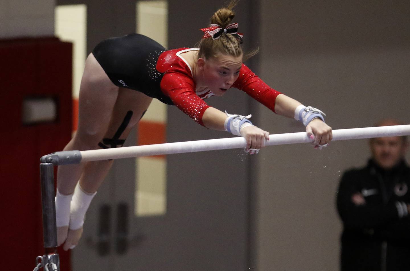 Palatine’s Jolee Waddington competes in the preliminary round of the uneven parallel bars  on Friday, Feb. 21, 2025, during the IHSA Girls State Final Gymnastics Meet at Palatine High School.