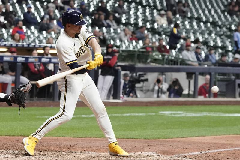 Milwaukee Brewers' Willy Adames hits an RBI single during the 10th inning of a baseball game against the Arizona Diamondbacks Monday, Oct. 3, 2022, in Milwaukee. (AP Photo/Morry Gash)