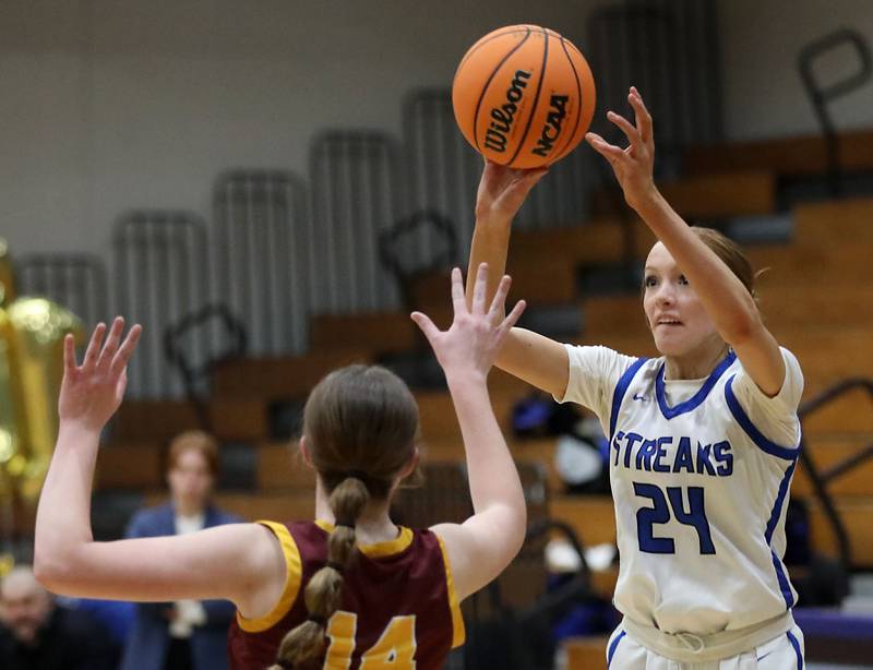 Woodstock's Aiyana Fourdyce (right) shoots the ball over Richmond-Burton's Lilly Kwapniewski during a Kishwaukee River Conference girls basketball game on Wednesday, Jan. 28, 2026, at Woodstock High School.