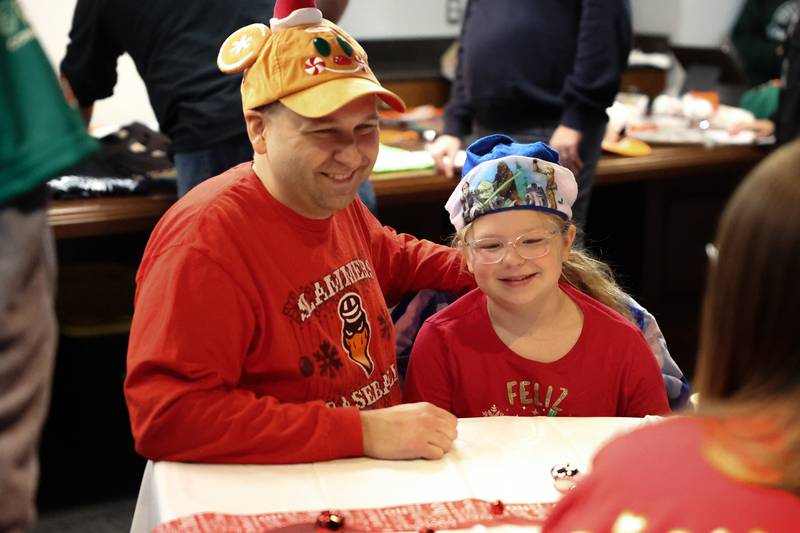 Kyle Stern and his daughter Scarlet, 10-years old enjoy the Joliet Slammers annual Holiday Open House on Saturday, December 2nd at Duly Health and Care Field in Joliet.