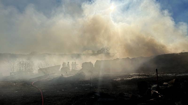 Firefighters from several departments responded to a field and hay bale fire at a farm on West Pines Road between Polo and Oregon on Monday, Feb. 23, 2026.