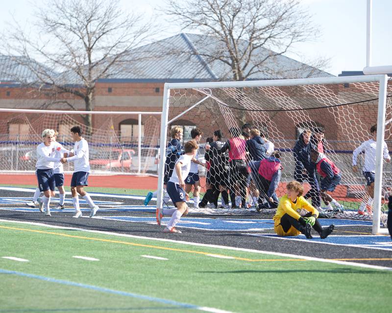 Conant celebrates the winning kick off goal against Geneva at the Class 3A St. Charles North Sectional Final on Saturday, Nov.2,2024 in St. Charles.