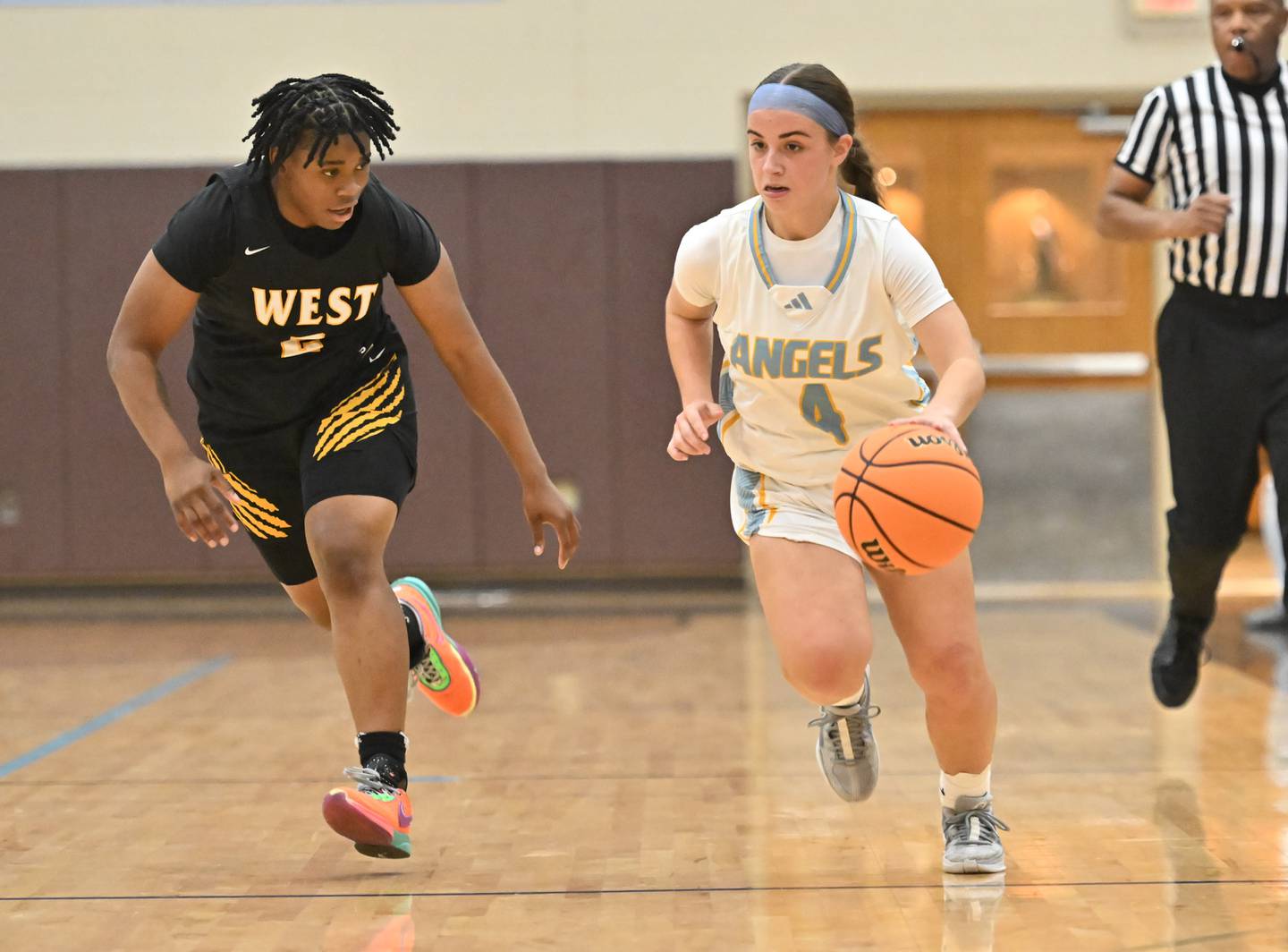 Joliet Catholic's guard Addison Farnaus (4) in action during the WJOL basketball tournament against Joliet West on Monday, Nov 18, 2024 at Joliet. (Dean Reid for Shaw Local News)