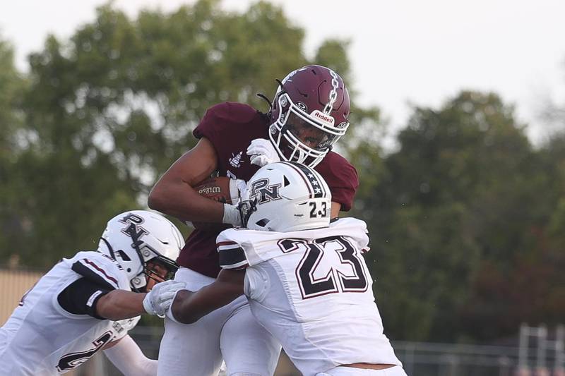 Lockport’s Izeyah Pruitt powers his way for extra yards after a catch against Plainfield North on Friday, August 30, 2024 in Lockport.