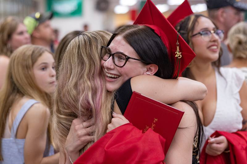 Addy Nance hugs a friend in the lobby after the ceremony at the LaSalle-Peru Township High School Class of 2025 commencement ceremony on Thursday, May 15, 2025 in Sellett Gymnasium.
