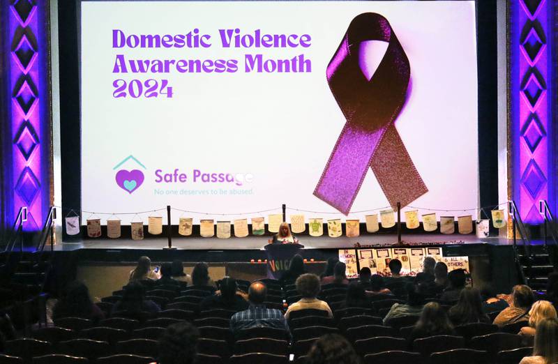 Mary Ellen Schaid, executive director of Safe Passage, opens up the speaking portion of the program Monday, Oct. 7, 2024, during the annual Safe Passage Domestic Violence Candlelight Vigil and Survivor Speak-Out inside the Egyptian Theatre in downtown DeKalb.