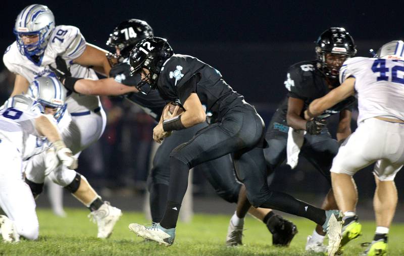 Woodstock North’s Landan Creighton runs the ball against Woodstock in varsity football at Woodstock North Friday night.