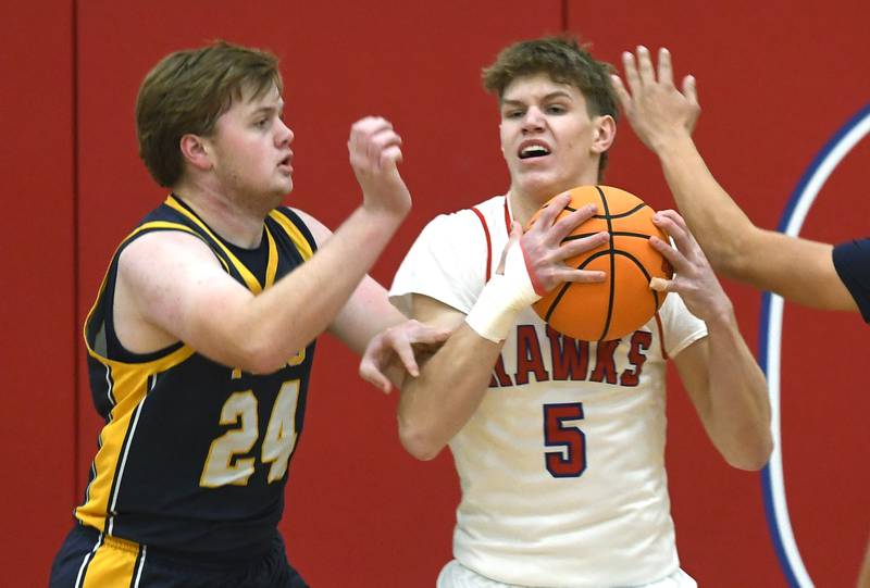 Polo's Aidan Messer (24) guards Oregon's Tucker O'Brien (5) on Friday, Dec. 5, 2025 at the Blackhawk Center in Oregon.