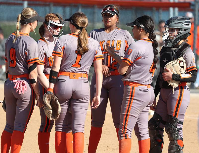 DeKalb players meet at the mound Thursday, May 8, 2025, during their game at Genoa-Kingston High School.