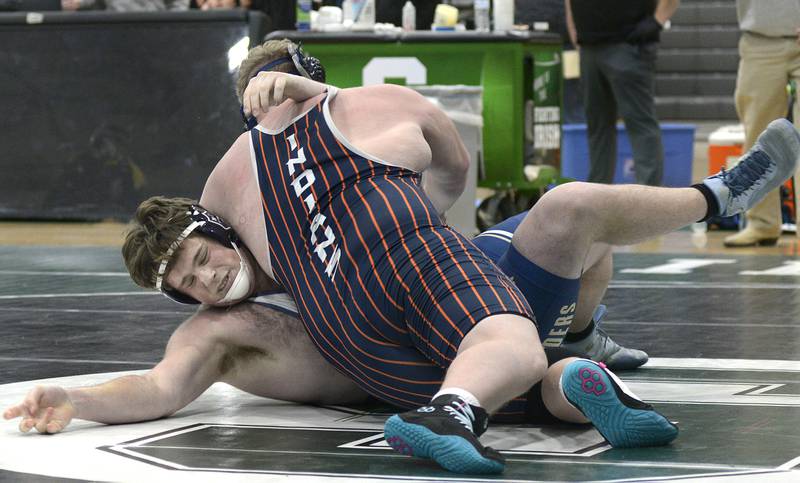Marquette’s Caden Shreve works to escape the hold by Pontiac’s Hunter McCullough in the 285# match Wednesday at Seneca.
