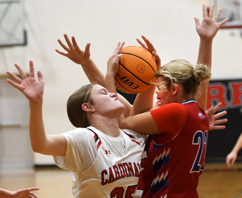 Forreston's Grace Holaday (25) and Morrison's Avery White (22) battle for the ball on Friday, Nov. 21, 2025 at the Forreston High School Girls Basketball Thanksgiving Tournament.