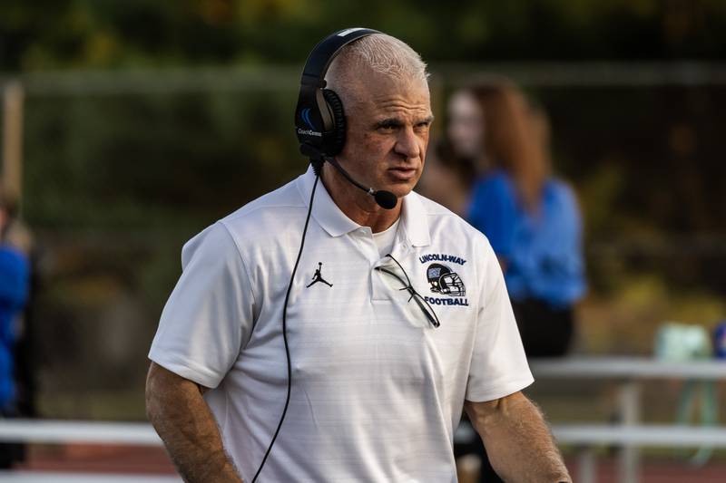 Lincoln-Way East’s head football coach Rob Zvonar leads his team during a varsity game against Metea Valley at Lincoln-Way East on Oct. 3, 2025.