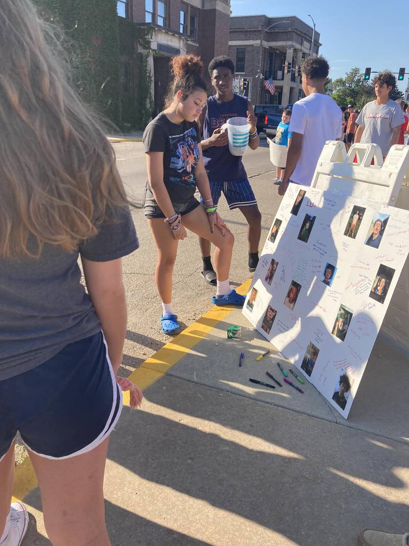 Dozens of students worked together Sunday, July 30, 2023, hosting a bake sale and lemonade stand on the 100 block of North Park Street to raise money for Jermaine McIntyre's family. McIntyre, of Streator, died after a drowning emergency Friday in Leland.
