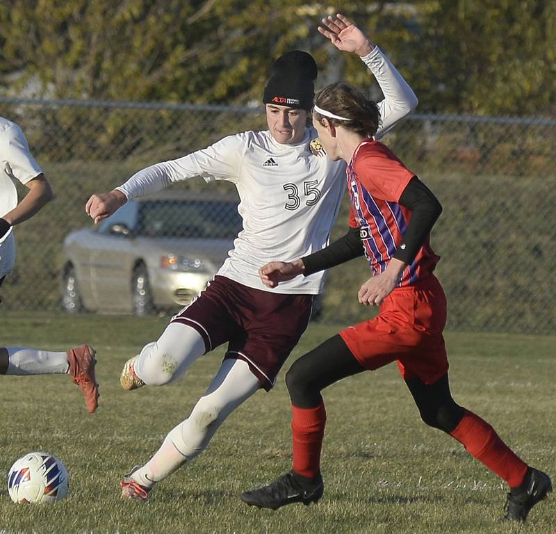 Morris’s Connor Ahearn prepares a kick past Orion’s Luke Moen in the Class 2A boys soccer Regional on Tuesday, Oct. 18, 2022 at the La Salle-Peru Athletic Complex in La Salle.