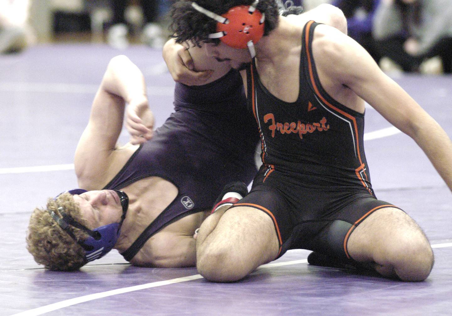 Dixon's Jayden Weidman grapples with Freeport's Sajjad Nathan Abdulrazzaq during the 150-pound third-place bout at the Class 2A Dixon Regional on Saturday, Feb. 8, 2025 at Lancaster Gym in Dixon.