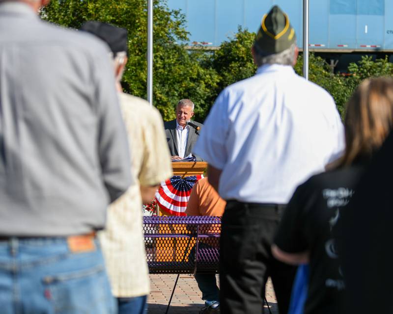 DeKalb mayor and veteran Cohen Barnes (middle) speaks during a dedication ceremony marking the completion of phase one of the DeKalb Elks Veteran’s Memorial Plaza in DeKalb Saturday, Oct. 1, 2022.