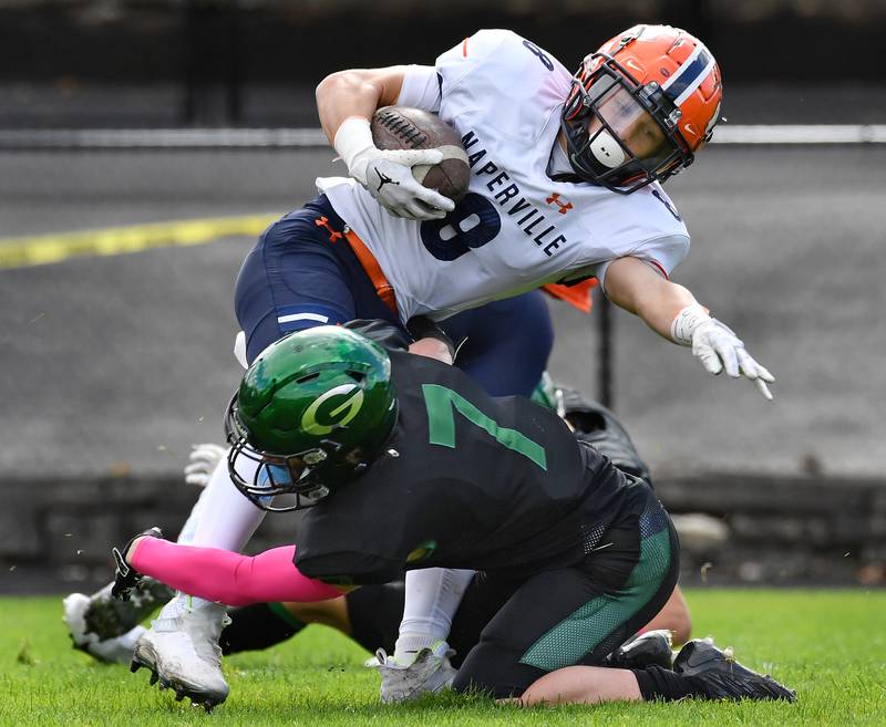 Glenbard West's Will Meyer (7) tackles Naperville North's Zachary Mally (8) at the seven yard line after a kickoff during an IHSA Class 8A playoff game on Oct. 28, 2023 at Glenbard West High School in Glen Ellyn.