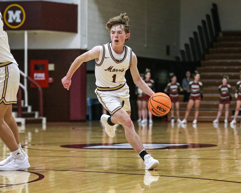 Morris's Landon Norris (1) drives around a screen during their basketball game between Wilmington at Morris. Saturday Jan 4, 2025 in Morris.