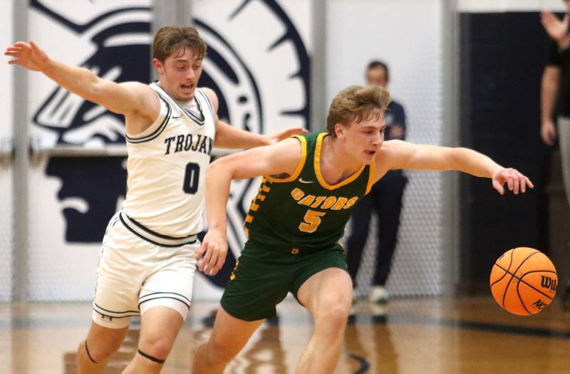 Cary-Grove’s Brandon Freund, left, battles Crystal Lake South’s Carson Trivellini in varsity boys basketball on Wednesday, Dec. 3, 2025, at Cary-Grove High School in Cary.
