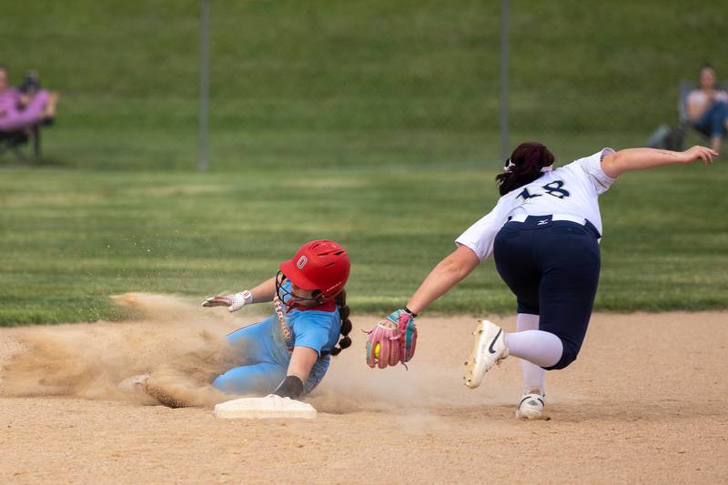 Avery Leigh (5) of Ottawa slides into second base as Natalie Pacyga (18) of Lemont attempts to tag out on Tuesday, June 3, 2025 at Ottawa High School in Ottawa.