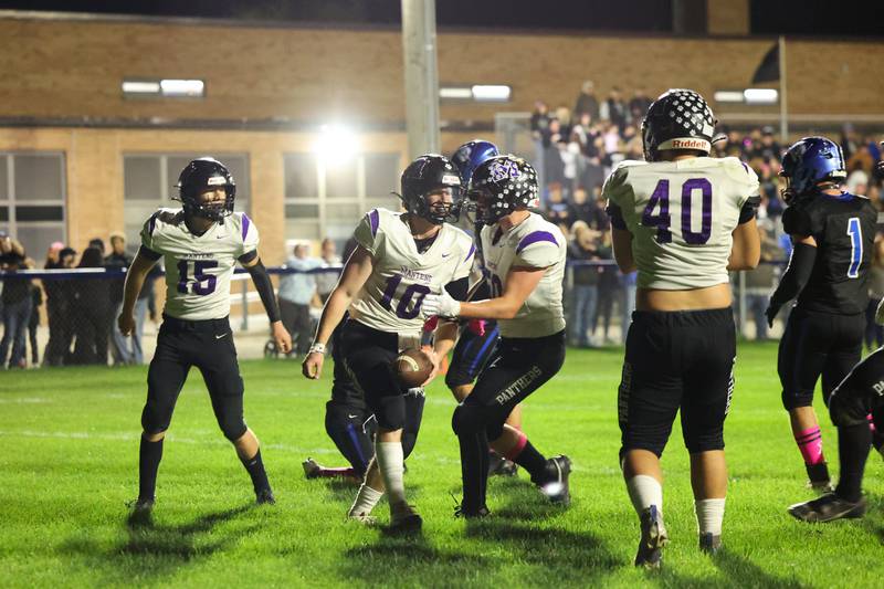 Manteno's Connor Harrod, center, celebrates scoring a touchdown during the Panthers' 25-20 victory over Peotone on Friday, Oct. 17, 2025, in the annual Rumble on Route 50 rivalry game.