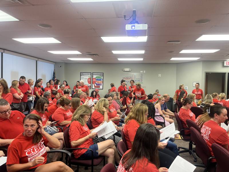 Over 100 people packed the Crystal Lake School District 47 board of education meeting Monday night wearing red shirts to stand in solidarity as negotiations for a new teacher’s contract continue on for eight months.