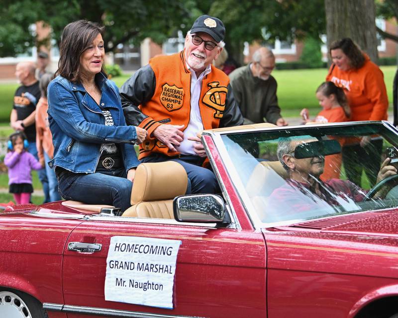 Crystal Lake Central H.S. honorary Grand Marshall "Mr. Naughton" as seen leading the procession of their 100 year anniversary homecoming day parade that featured alumni from various graduating classes on Saturday, Sep. 16, 2023 in Crystal Lake. The parade began at the high school and made its way through downtown Crystal Lake.