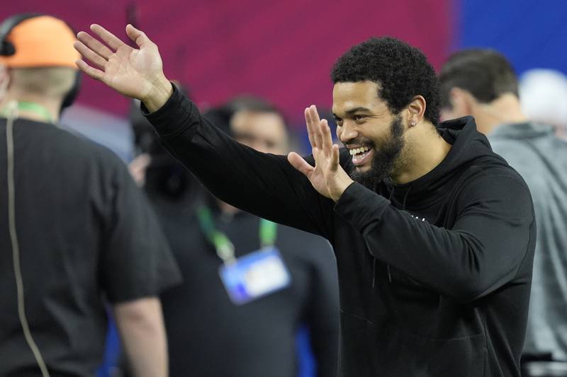 USC quarterback Caleb Williams watches as players run a drill at the NFL combine, Saturday, March 2, 2024, in Indianapolis.