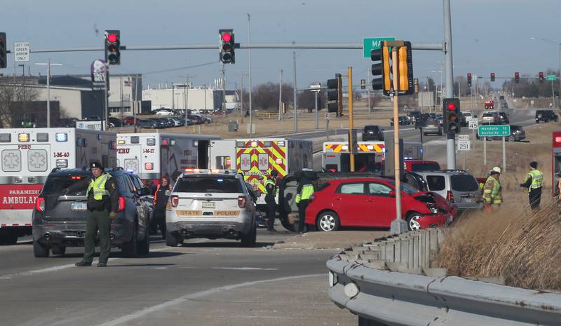 Emergency crews work the scene of a multiple vehicle crash at the intersection of Illinois Route 251 and May Road on Monday, May, 27, 2025 in Peru. The crash happened around 12:45p.m. Ambulances from Peru, La Salle, Mendota Spring Valley, and Oglesby responded to the scene to transport multiple victums to area hospitals.