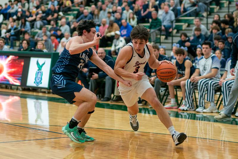 Benet’s Brady Kunka (3) drives to the hoop against Lake Park's Dennasio LaGioia (24) during a Bartlett 4A Sectional semifinal boys basketball game at Bartlett High School on Tuesday, Feb 28, 2023.