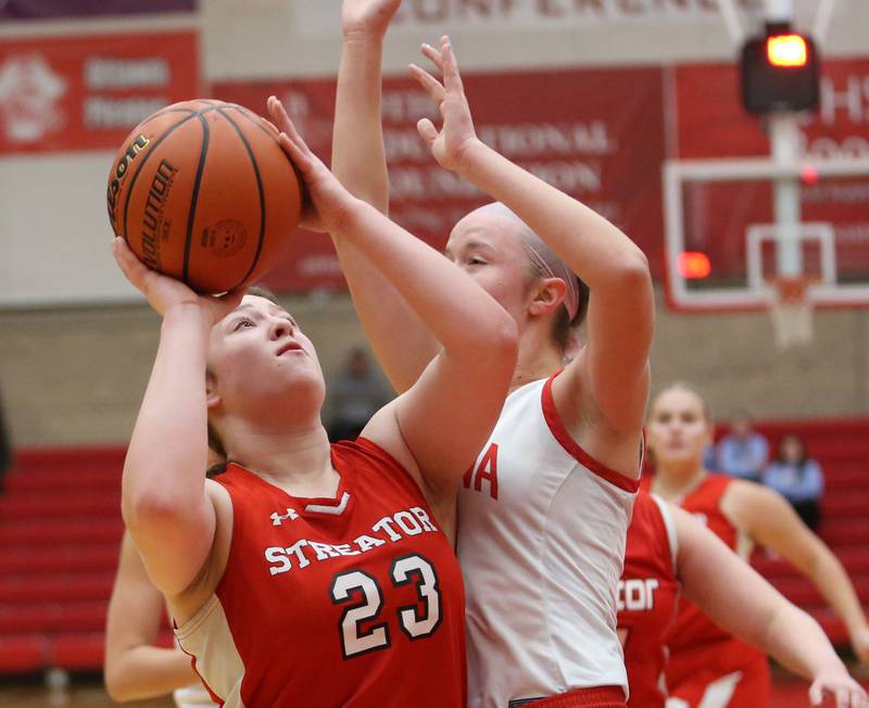 Streator's Leah Krohe eyes the hoop while being guarded by Ottawa's Hailey Larsen during the Lady Pirate Holiday Tournament on Wednesday, Dec. 20, 2023 in Kingman Gym.