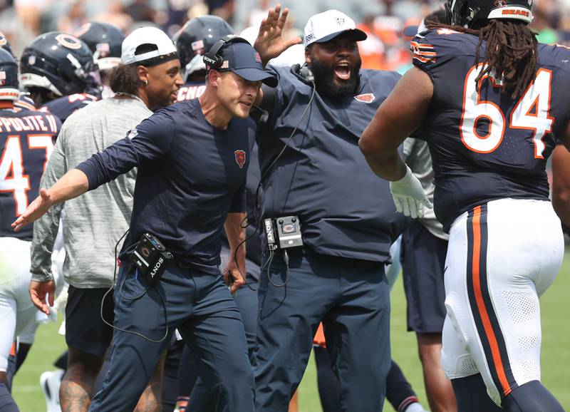 Chicago Bears Head Coach Ben Johnson is fired up after his defense makes a goal-line stand early in the game Sunday, Aug. 10, 2025, during their preseason game against the Miami Dolphins at Soldier Field in Chicago.