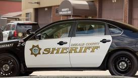 Woman hospitalized after DeKalb car crash