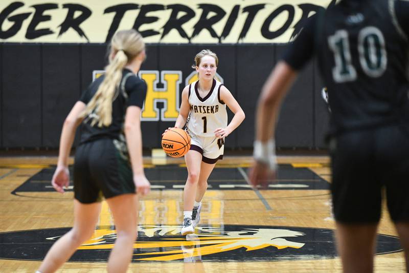 Watseka-Milford's Kami Muehling brings the ball up during the Warriors' 69-38 loss to Bishop McNamara in the IHSA Class 2A Herscher Sectional championship on Thursday, Feb. 27.