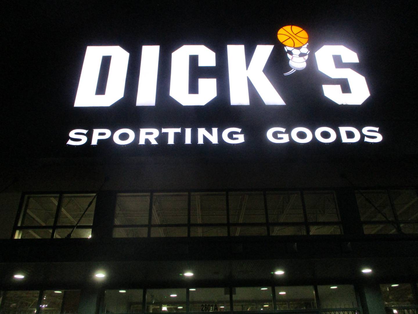 The Dick's Sporting Goods store sign in Joliet is lit up at night. May 5, 2026