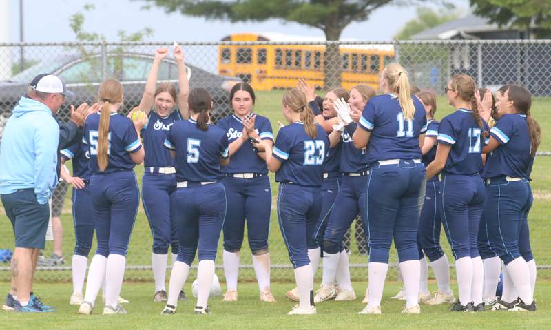 Members of the Bureau Valley Storm softball team gather after defeating Erie-Prophetstown during the Class 1A Regional game on Monday, May 13, 2024 at Bureau Valley High School.