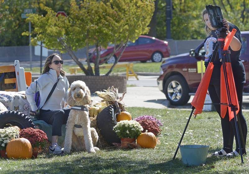 Pets and their owners could have a photo taken in an autumn atmosphere by Kane Family Farms on Sunday, Oct. 6, 2024, during the annual Bill’s Barktoberfest on the Jordan block in Ottawa.