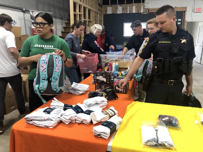 Volunteers joined Kids in Need of McHenry County and Toys for Tots on Saturday, May 11, 2024, to stuff 100 care bags for children entering or transitioning in the foster care system.