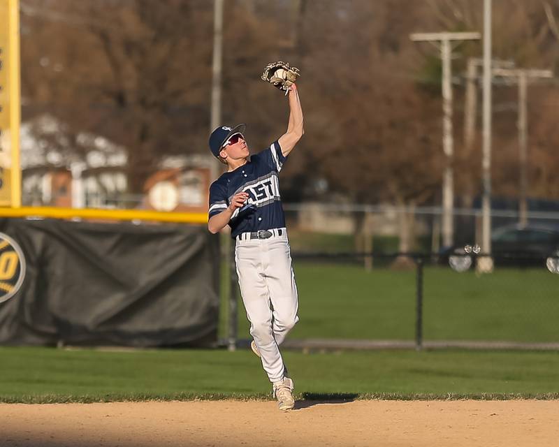 Oswego East's Mike Polubinski (1) makes a catch during varsity baseball game between Oswego East at Joliet West.  April 10, 2023.