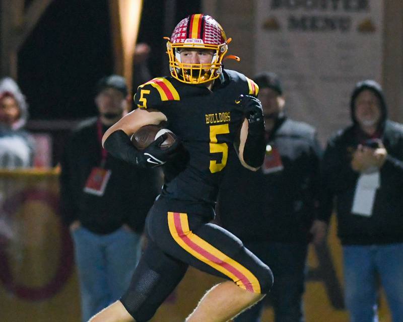 Batavia's Jack Brown (5) looks for any Hoffman Estate defenders as he breaks away for a touchdown during the first round of playoffs on Friday Oct. 31, 2025, held at Batavia High School.
