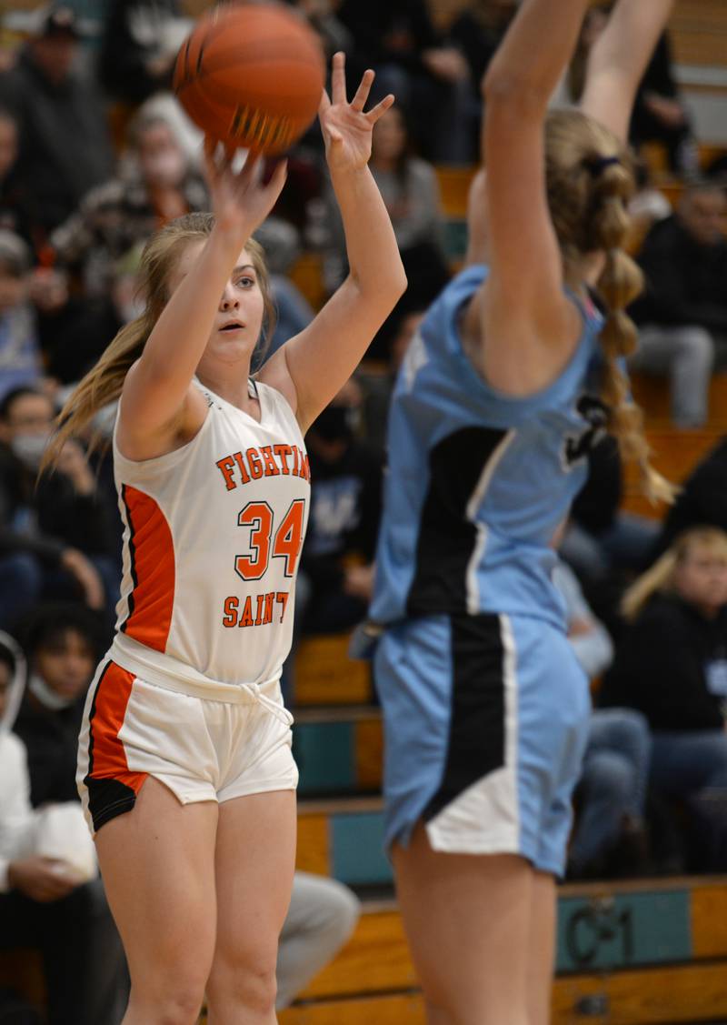 St. Charles East's Emma Yakey makes a basket during their regional game against Willowbrook Thursday Feb. 17, 2022.
