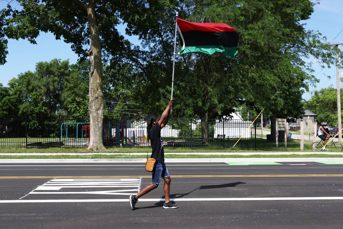 Kankakee native Larry Lewis leads the parade down Hobbie Avenue during the annual Kankakee Juneteenth Parade on Saturday, June 21, 2025.