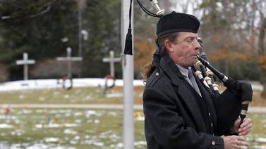 Photos: Flags placed on veterans' gravesites in Woodstock on Veterans Day
