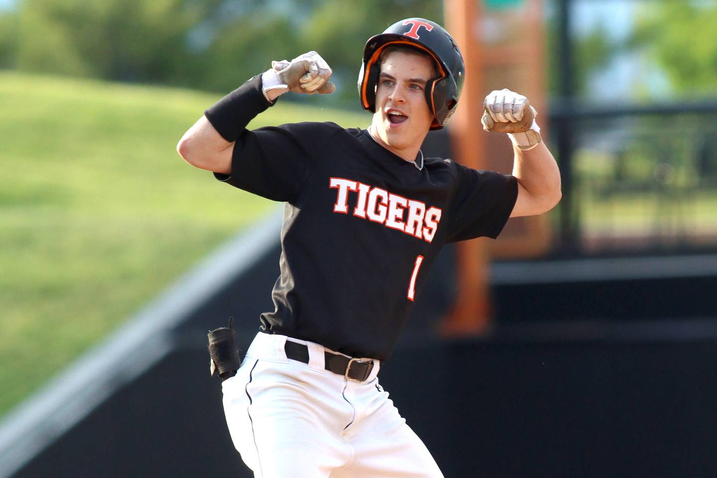 Crystal Lake Central’s Drew Welder flexes after arriving at second base with a double in supersectional baseball action against DePaul College Prep at Wintrust Field in Schaumburg Monday.